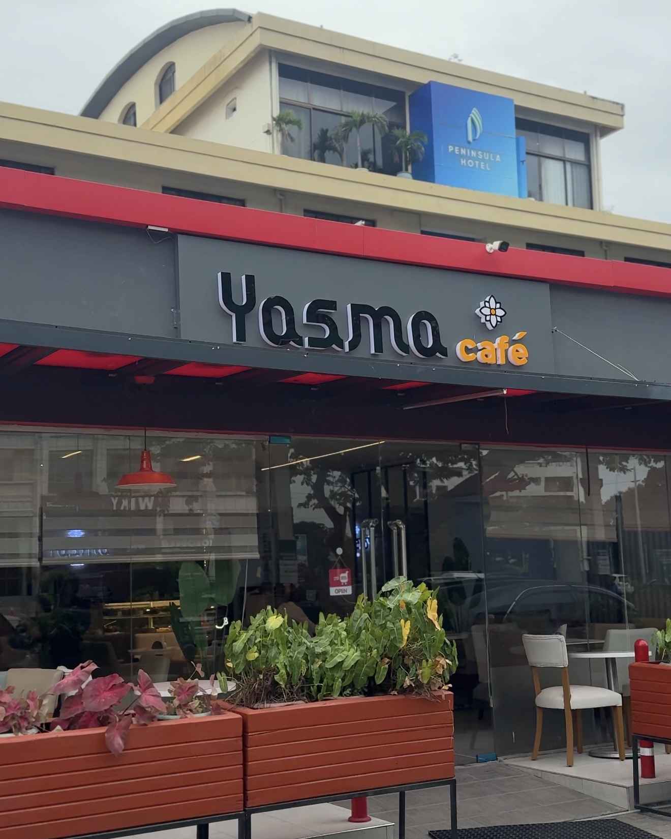 The Yasma Cafe storefront with its red awning on Haile Selassie Road