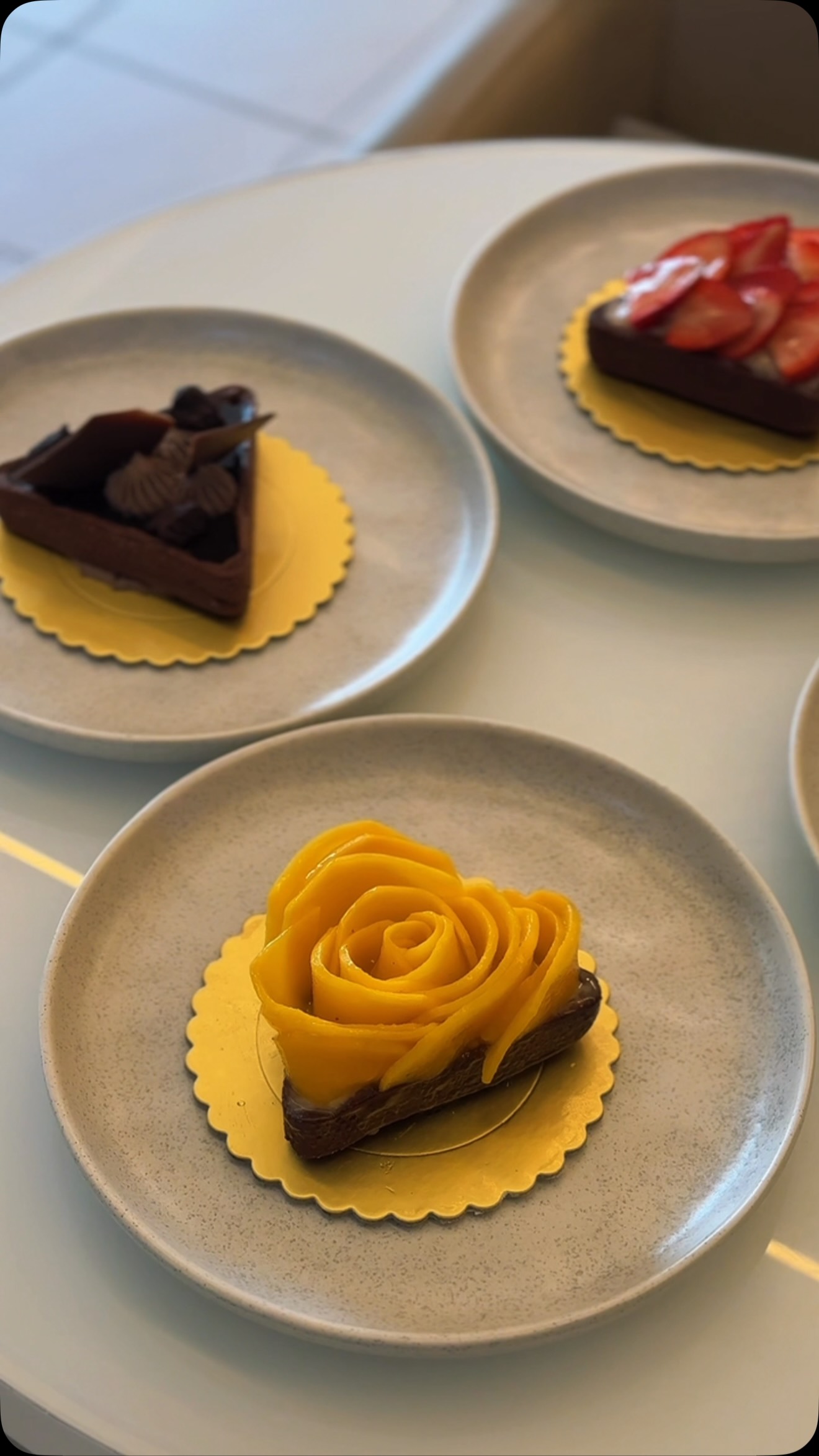 The mango rose tart with chocolate and strawberry tarts at Yasma